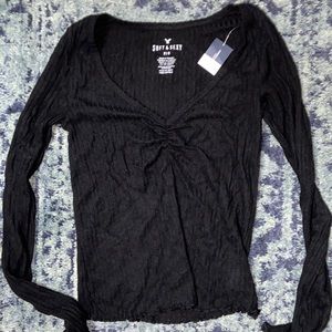 Tight black top with detail in chest